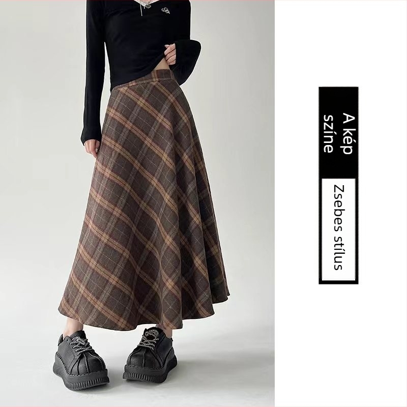 Középmagasságú, magas derekú esernyőszoknya csíkos/kockás mintával; poliészter anyag gyapjúkeverékkel és 30% alatti pamut tartalommal; mikro-elasztikusság; őszi-téli 2025