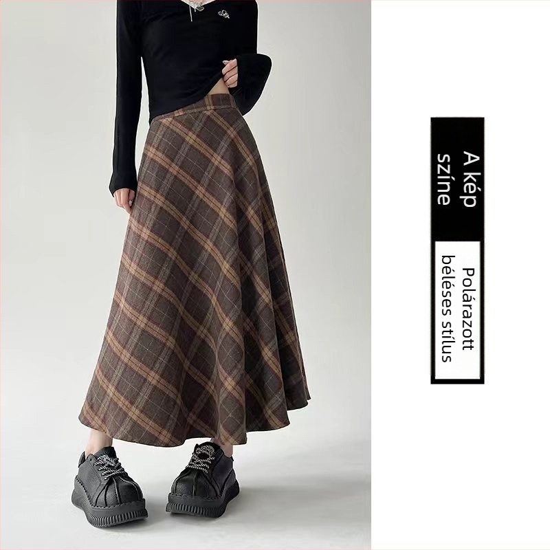 Középmagasságú, magas derekú esernyőszoknya csíkos/kockás mintával; poliészter anyag gyapjúkeverékkel és 30% alatti pamut tartalommal; mikro-elasztikusság; őszi-téli 2025