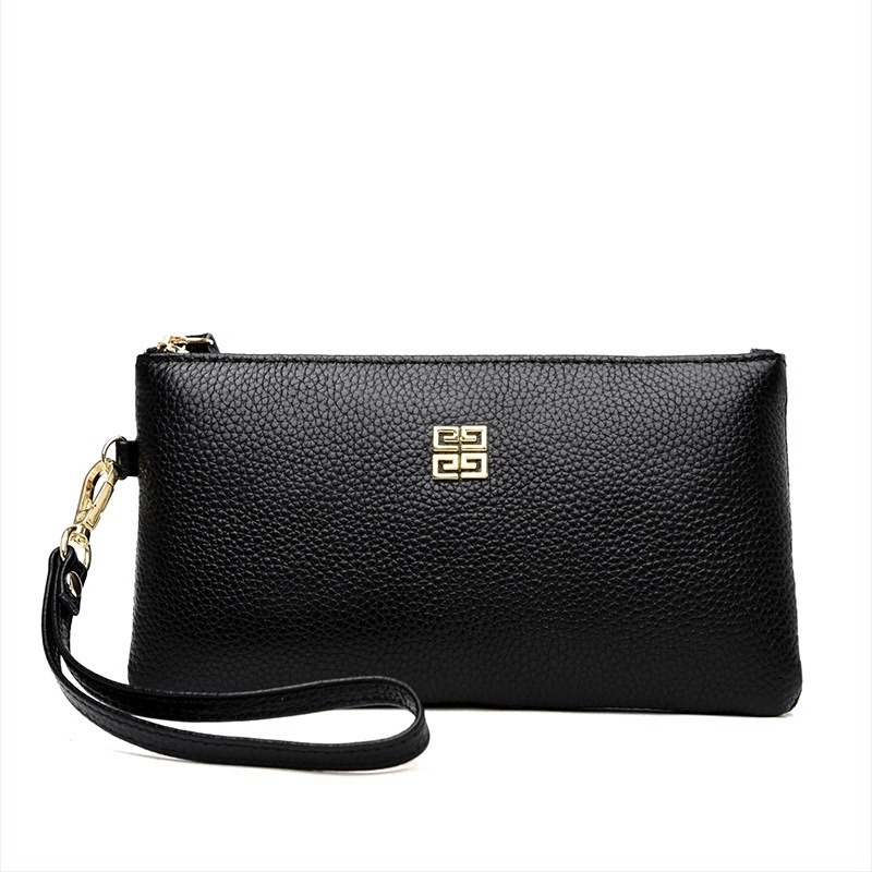 Női clutch táska valódi bőrből, vízszintes négyzet alakú, cipzáras zárás, belső telefonzseb, poliészter bélés.