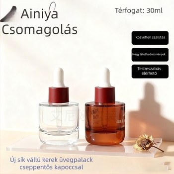 Kézzel fújt üvegből készült cseppentővel ellátott üveg, cilindrikus, sík vállú; felületi kezelések: spray bevonat, forró nyomtatás, elektroplakálás; testreszabható lehetőségek.