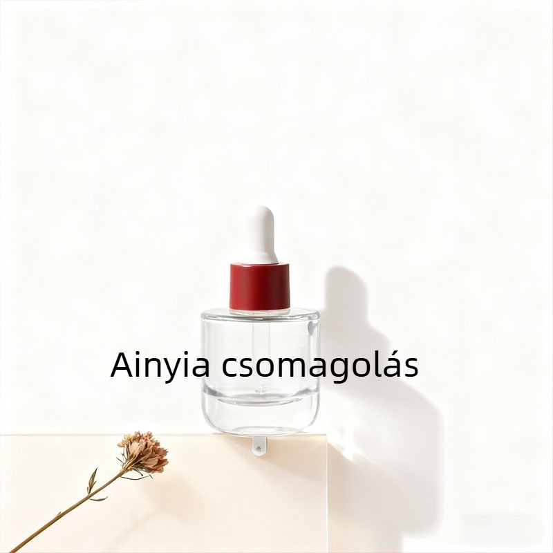 Kézzel fújt üvegből készült cseppentővel ellátott üveg, cilindrikus, sík vállú; felületi kezelések: spray bevonat, forró nyomtatás, elektroplakálás; testreszabható lehetőségek.