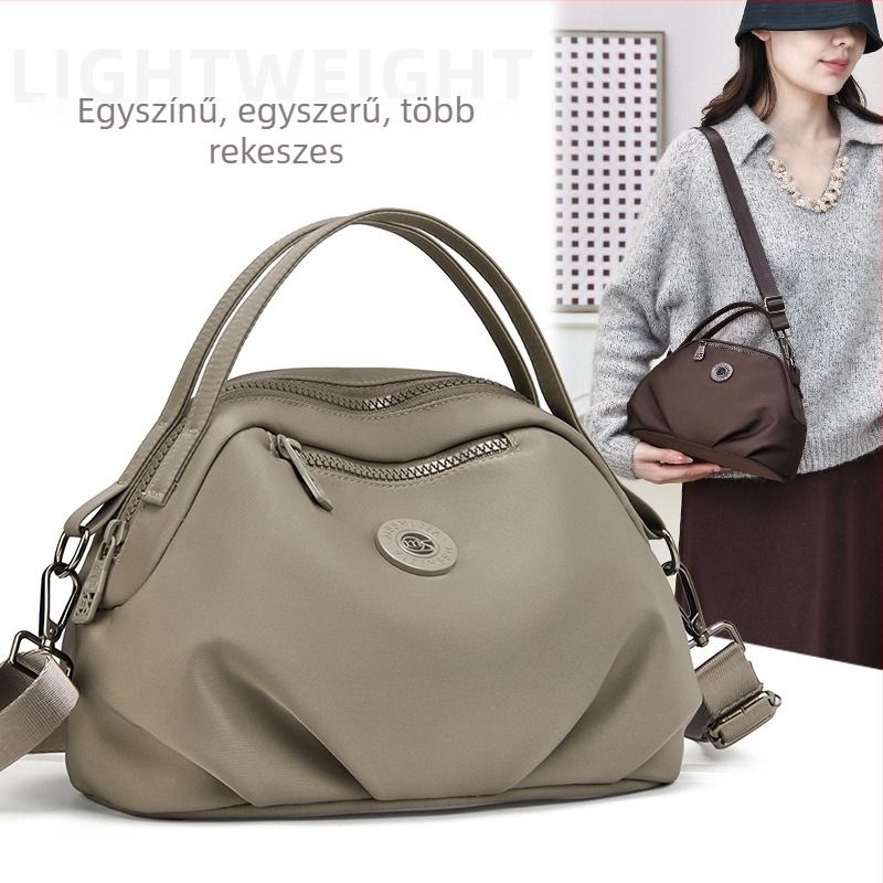 Női crossbody táska nylonból, városi minimalist stílus, ovális forma, cipzáras nyitás, belső cipzáras zseb