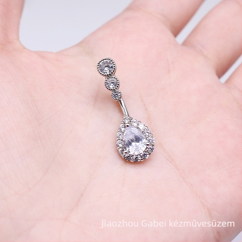 Nabő piercing ékszer - vízcsepp formájú köldökpiercing három zirkon kövekkel, kapcsok alak, uniszex, rajzfilm stílus, sárgaréz + fehér acél, testreszabás elérhető