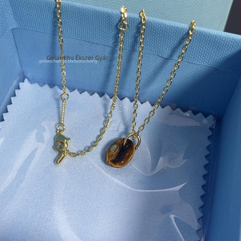 Női Tiger Eye kőből készült nyaklánc, U-alakú geometriájú medállal, elektroplatírozott keresztes lánccal, könnyed luxus stílus