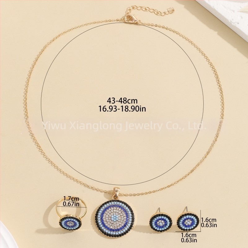 Démon Szem motívumú ékszerszett — rhinestone kövek, elektroplatina bevonat, tartalmaz fülbevalókat, nyakláncot és karkötőt, O-alakú lánccal