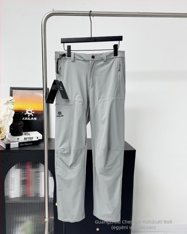 Kailas Softshell sportnadrág hímzett logóval, szél- és vízálló, légáteresztő, több zseb, enyhén bővülő szár, középmagas derék, elöl gombos zárás