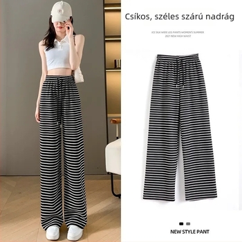 Női fekete-fehér csíkos casual nadrág, magas derék, karcsúsító fazon, egyenesből széles szárú, padlóra érő.
