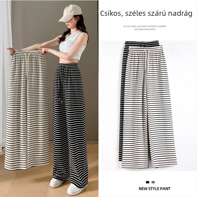 Női fekete-fehér csíkos casual nadrág, magas derék, karcsúsító fazon, egyenesből széles szárú, padlóra érő.