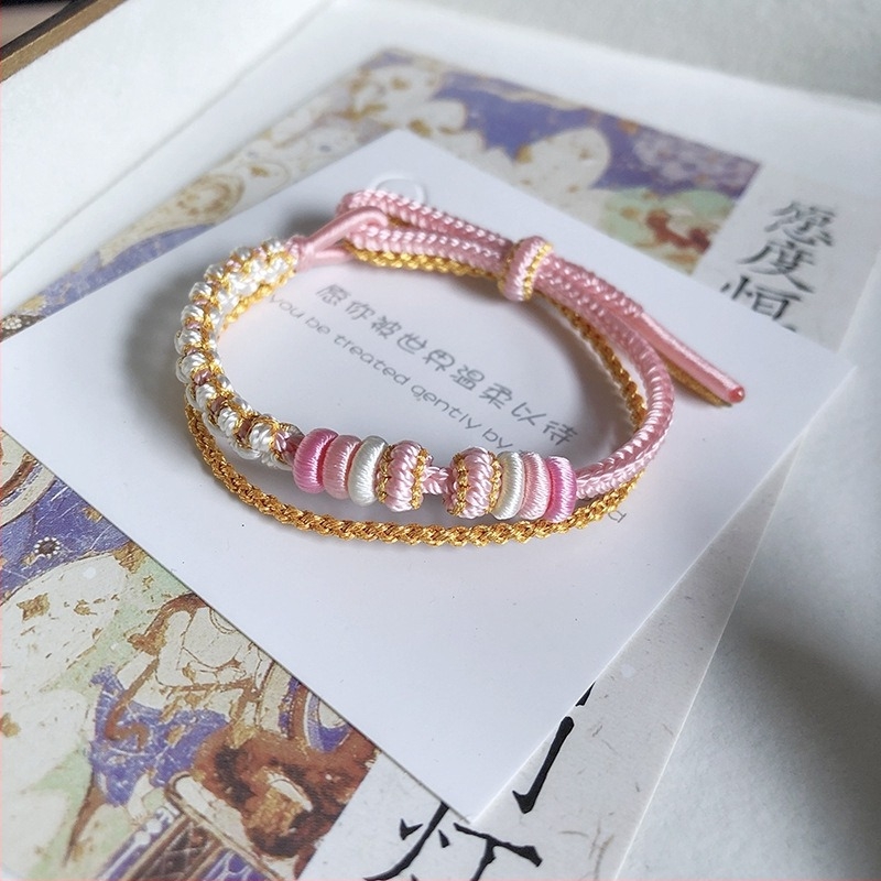 Uniszex karkötő kézzel kötött zsinórból Peach Blossom motívummal