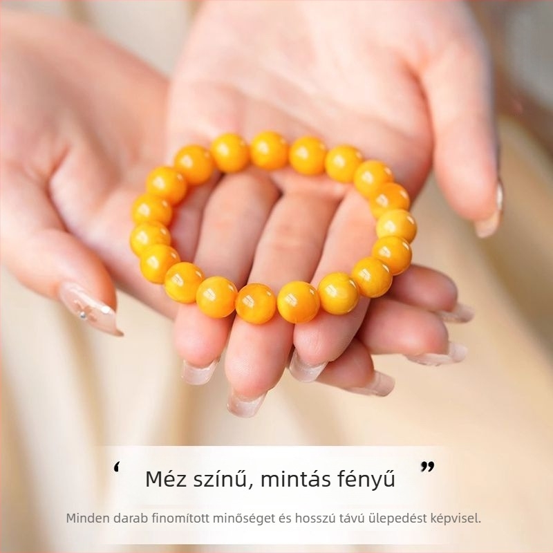 Borostyán karkötő arany berakásokkal és jáde betétekkel, kézzel készített, geometriás dizájn