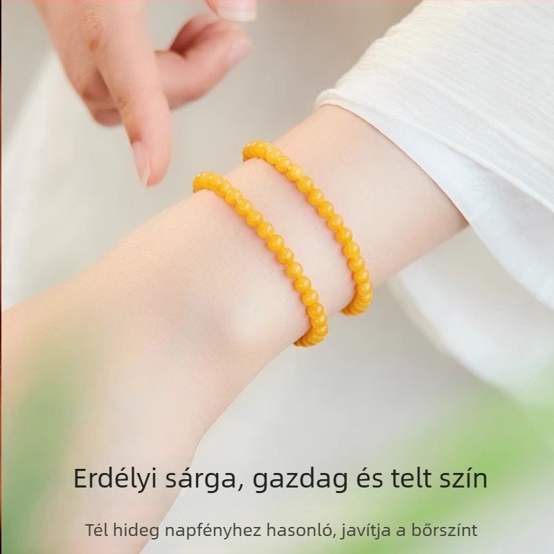 Borostyán karkötő arany berakásokkal és jáde betétekkel, kézzel készített, geometriás dizájn