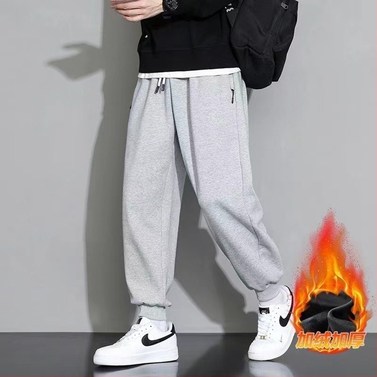 Férfi sportos nadrág, laza szabású, középmagas derekú, kötős zárás és öv, fleece pamut anyag