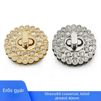 Bőrönd-kiegészítők: kis kerek zár, cirkóniás díszítés, cink ötvözet, világos arany/ezüst/fehér felület.