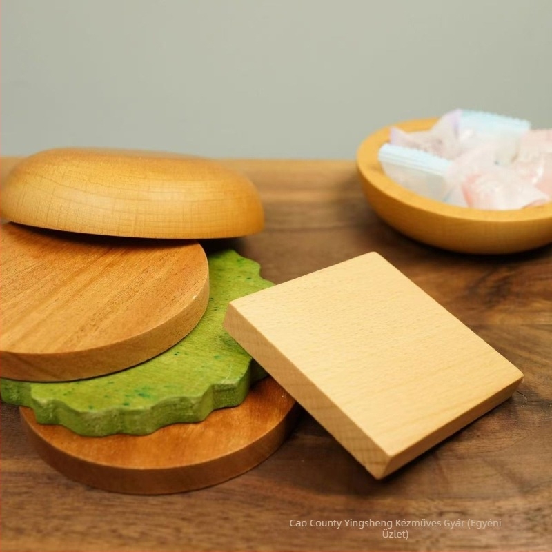 Fából készült hamburger formájú poháralátét – dekoratív és funkcionális, hőszigetelő; Anyag: fa; Minta: rajzolt; Forma: szabálytalan; Eredet: Shandong; Stílus: modern és minimalistikus