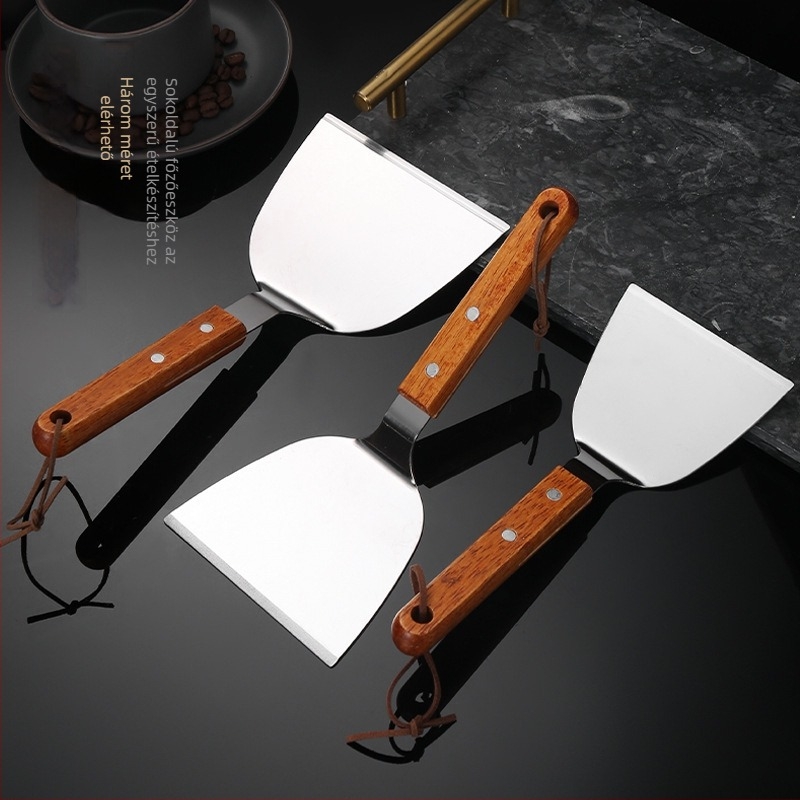 Rozsdamentes acél teppanyaki spatula tömörfa markolatával, vastag sík pengével — tapadásmentes, hőálló, csúszásmentes, ideális palacsintához és pizzához