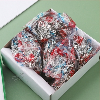 Fém biztonsági tű ruházathoz, régimódi ívelt csat