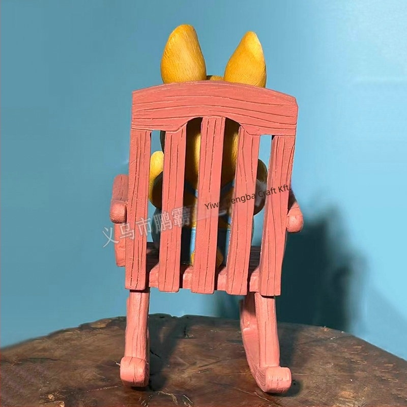 Olvasó nyúl hintázó székkel – kültéri dekoráció kertbe és erkélyre, cartoon stílusú, szintetikus gyantából készült