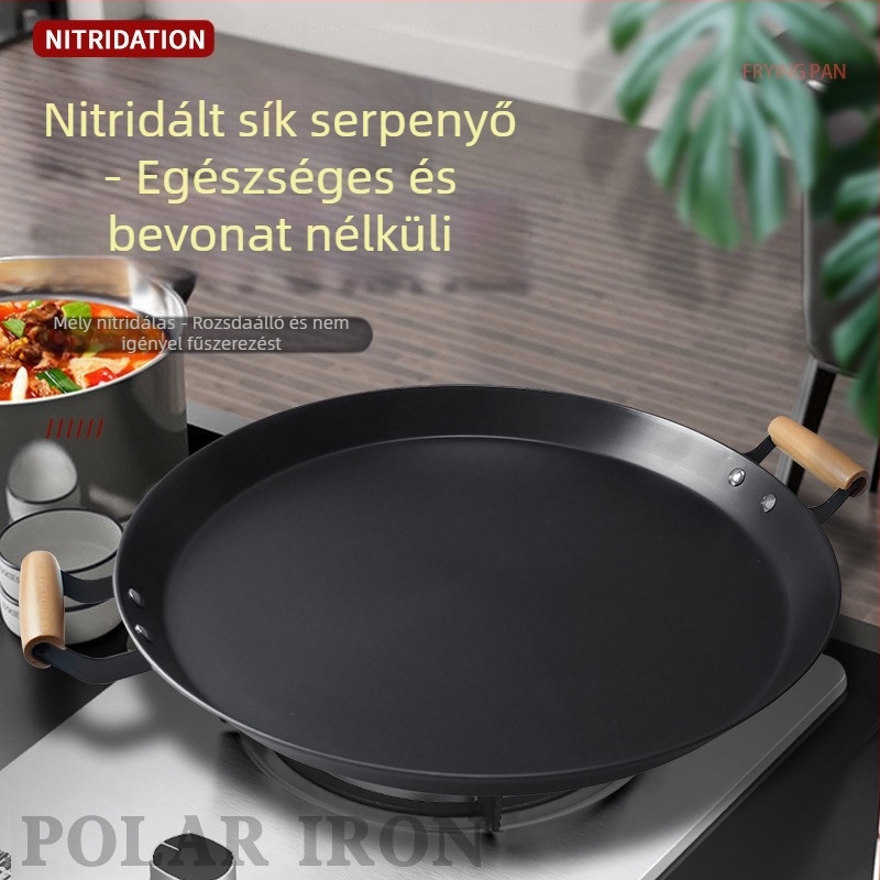 Kétfülű serpenyő, vastagított, bevonat nélküli, kovácsoltvasból készült, alja szénacél, gáztűzhely és indukciós főzőfelülettel