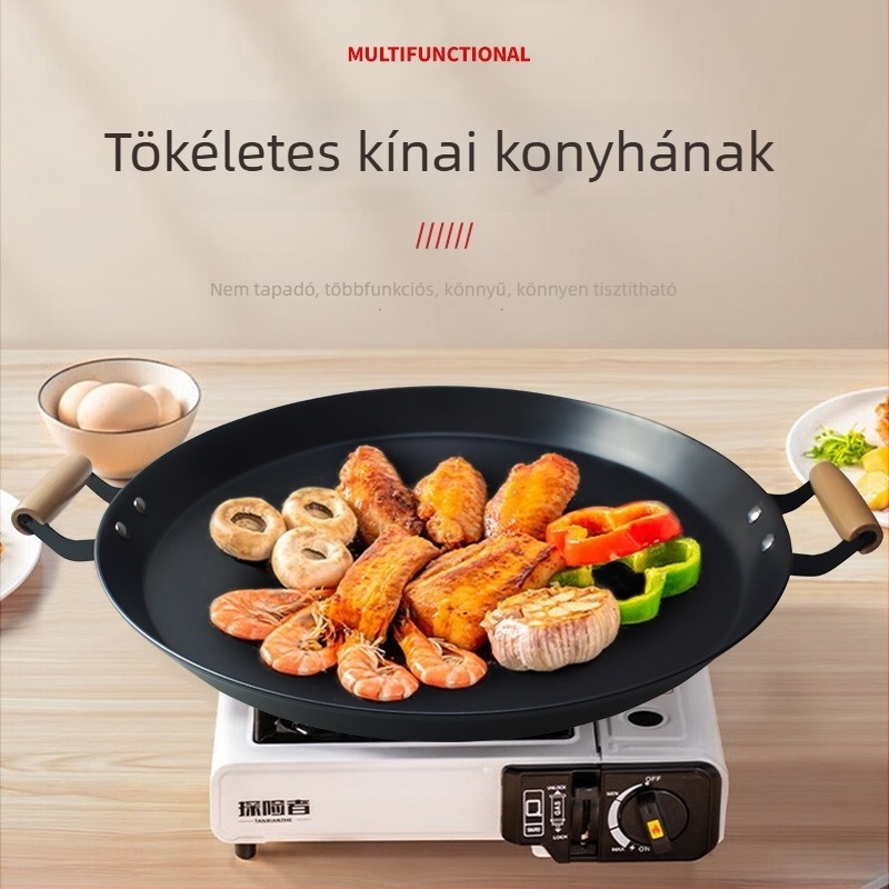 Kétfülű serpenyő, vastagított, bevonat nélküli, kovácsoltvasból készült, alja szénacél, gáztűzhely és indukciós főzőfelülettel