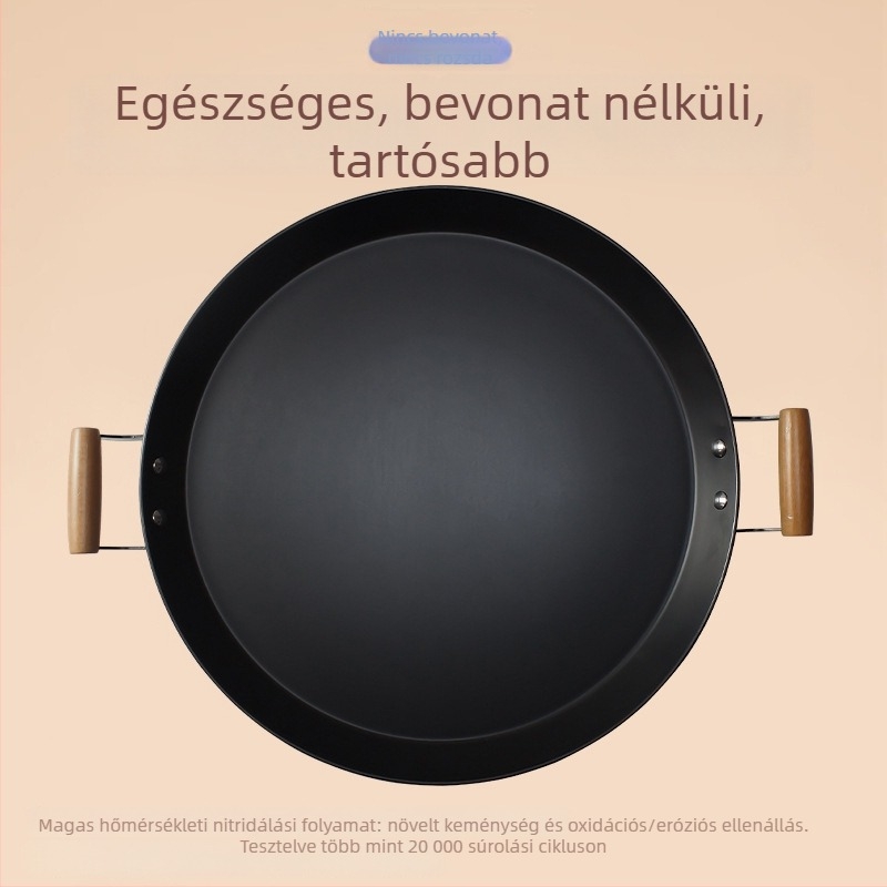 Kétfülű serpenyő, vastagított, bevonat nélküli, kovácsoltvasból készült, alja szénacél, gáztűzhely és indukciós főzőfelülettel
