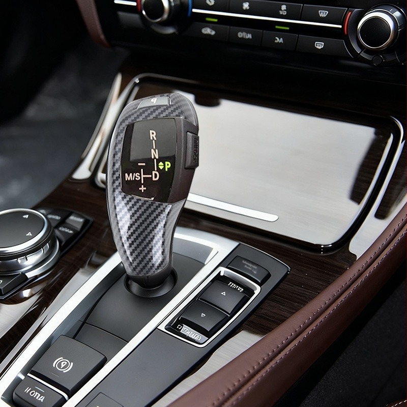 BMW 5 Series (08–13) X5/X6 váltókarfedő, szénszálas, ragasztásos telepítés, középkonzolhoz, testreszabható
