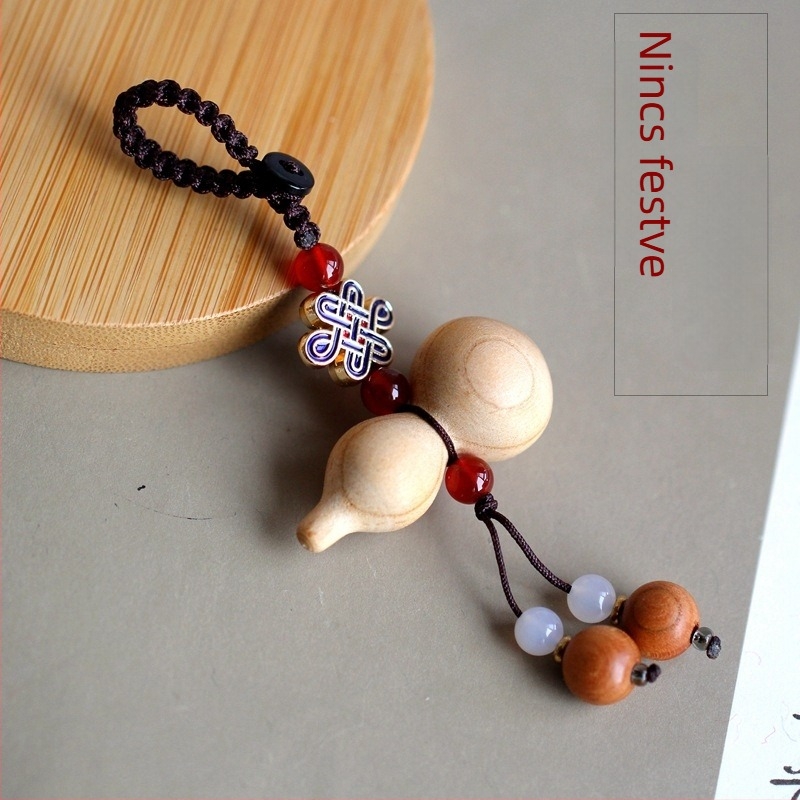 Autókulcs-gyűrű barackfa anyagból, Mu ran márka, modell 888