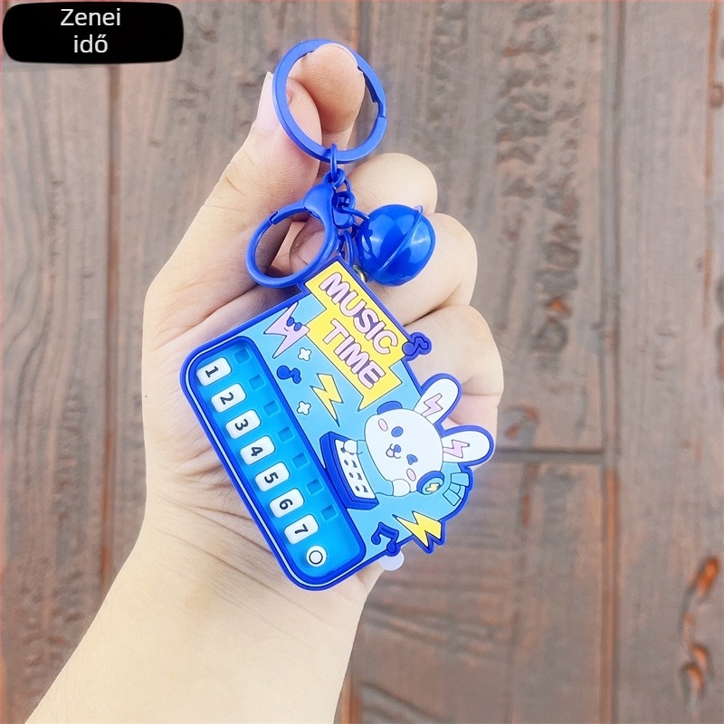 Világító mini zongora kulcstartó — oktató kézben tartható zenei játék, műanyagból
