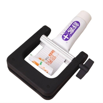 Kézi, fém fogkrémnyomó eszköz, rozsdamentes acélból, klip-stílusú pasztanyomó (Anyag: rozsdamentes acél; Működés: kézi; Alkalmazás: fogkrém és hajfesték paszták)