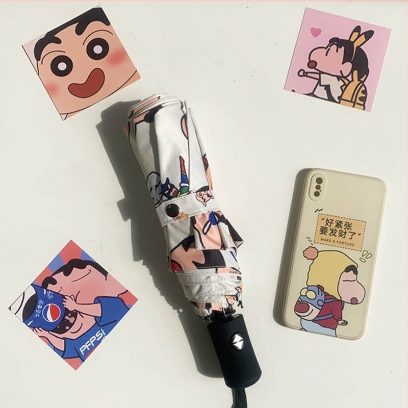 Háromrészes Shin-Chan mintás esernyő, UPF>50 napvédelem, 8 bordás rostos váz, acél tengely.