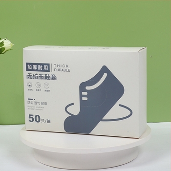 Egyszer használatos cipővédők, falra szerelt adagolóval, textil anyag, csúszásmentes, 4 g vastagság, testreszabott mintával és nyomtatott logóval, 50 db dobozonként