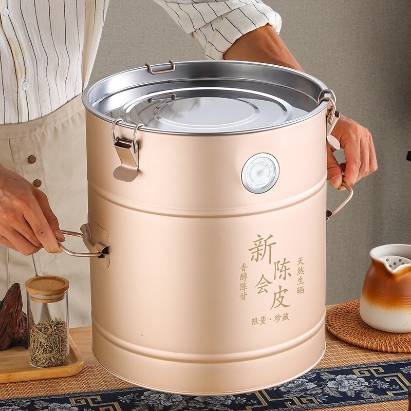 Rozsdamentes acélból készült kerek tea-tároló nedvességmérővel, 5L+ kapacitás, nedvességálló zárás, frissesség megőrzése, kínai stílus.