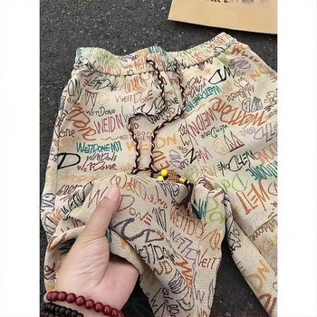 Dopamine Graffiti rövidnadrág – laza szabás, öt pont hossz, 100% poliészter, nyár 2025