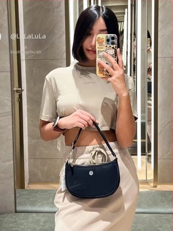 Alkarban hordható táska, nylon anyagú, gombóc alakú mini telefon-táska, cipzáras nyitással és rejtett zsebbel, street style, egylábas vállpánt