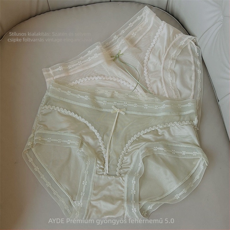 Női hálószövésű alsó középső derekú, lélegző, antibakteriális, nylon anyag, alsó csúcsban mulberry selyem betét, csipkés masni részlettel