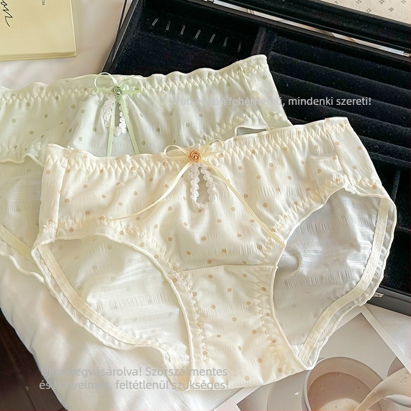 Női háromszög alakú alsónemű pöttyös mintával, középmagas derék, poliészter anyag pamuttal bélelt, lélegző és antibakteriális