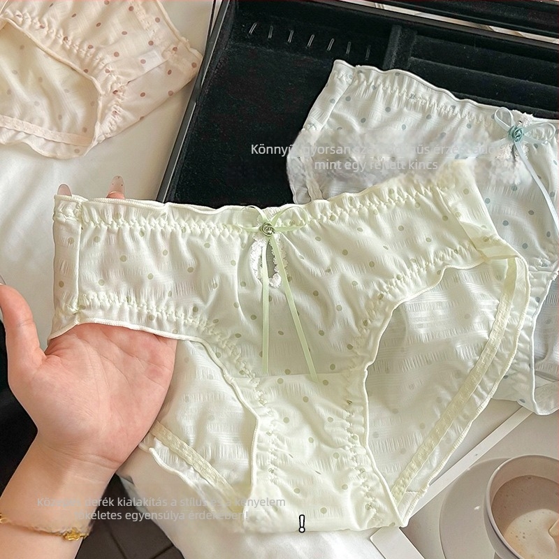Női háromszög alakú alsónemű pöttyös mintával, középmagas derék, poliészter anyag pamuttal bélelt, lélegző és antibakteriális