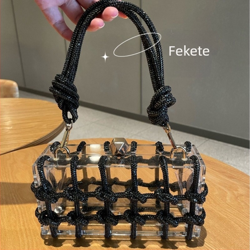 Akryl doboz formájú esté táska kristályokkal, átlátszó, zárható, belső zsebek a telefon számára és azonosító kártya, bélés nélkül, egy vállpánttal (Anyaga: akril; Forma: doboz; Zár: zár; Belső zsebek: telefon, azonosító kártya; Belső anyag: bélés hiányzik)