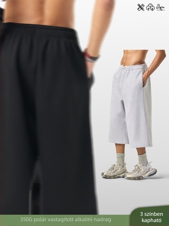 Férfiaknak lazán szabott cropped szélesszárú melegítőnadrág fleece béléssel, egyszínű, téli