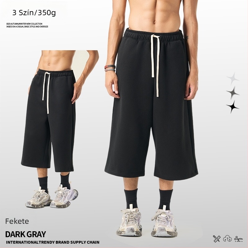 Férfiaknak lazán szabott cropped szélesszárú melegítőnadrág fleece béléssel, egyszínű, téli