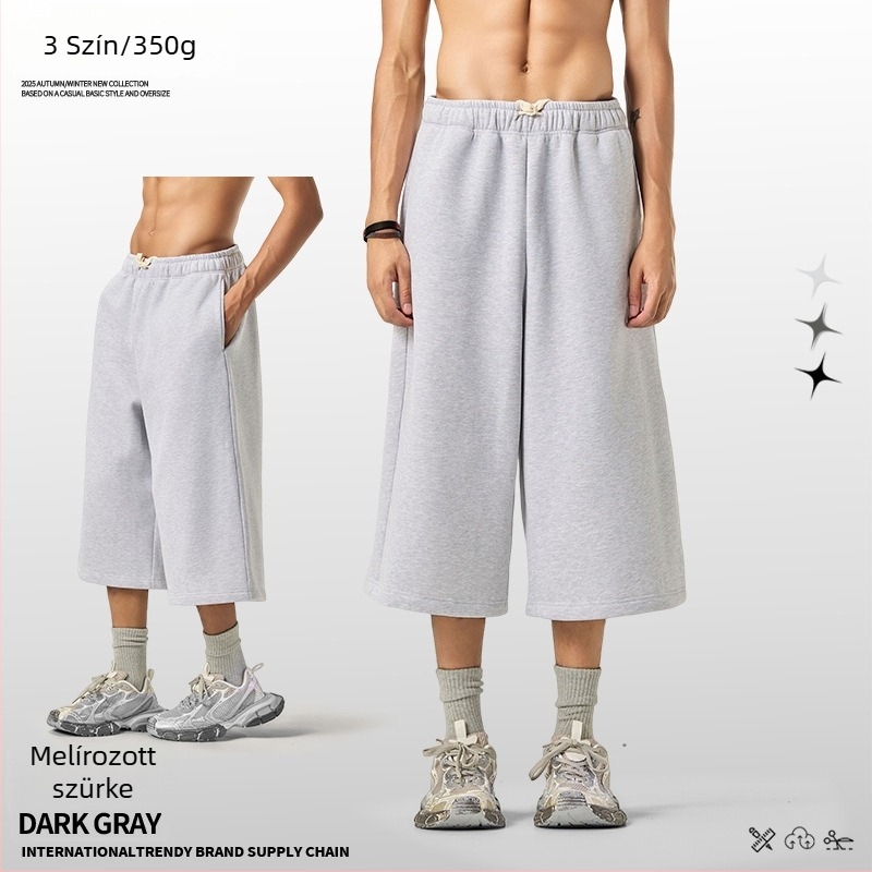 Férfiaknak lazán szabott cropped szélesszárú melegítőnadrág fleece béléssel, egyszínű, téli