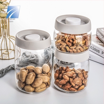 Boroszilika üveg tárolóedény vákuumzárású fedéllel, tea, cukorkák és snackek tárolására, 800–1000 ml, kerek, mikrohullámú sütőben is használható