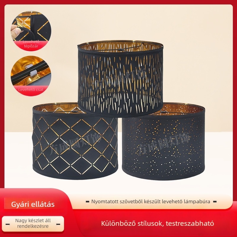 Textil lámpabura fekete külsővel és arany belsővel, üreges gravírozott mintával.