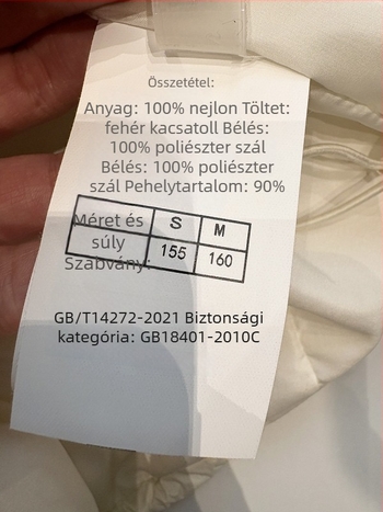 2025 téli női rövid tollkabát kötött kapucnival, koreai stílus, lazán szabott