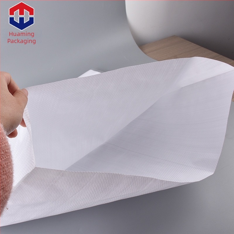 65 x 100 cm PP filmlaminált szövött zacskó, fehér, vastag műanyag kígyóbőr mintázatú zacskó