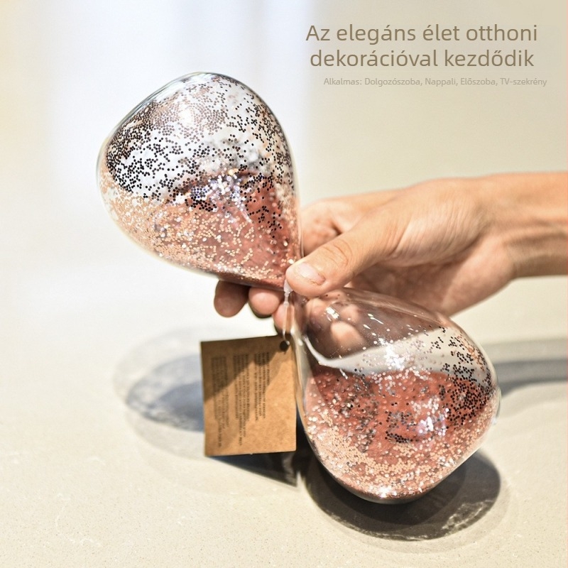 Rózsaszín üveg homokóra paillettes díszítéssel – modern otthoni dekoráció az íróasztalhoz