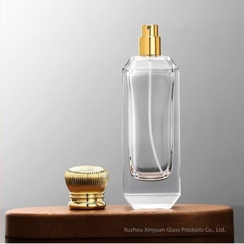 100 ml-es üveg parfüm-újratöltő, ferde vállú, nyomógombos permetezővel, utazáshoz