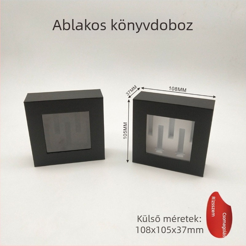 Fekete karton doboz ablakkal és nyitható fedéllel, mágneses könyv alakú belső USB-memóriához és Bluetooth fejhallgatóhoz