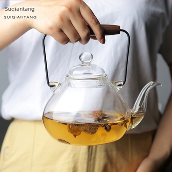 Japán stílusú, hőálló üvegből készült teáskanna fa fogantyúval és emelő füllel a tea készítéséhez
