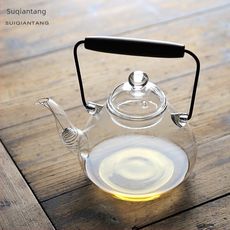 Japán stílusú, hőálló üvegből készült teáskanna fa fogantyúval és emelő füllel a tea készítéséhez