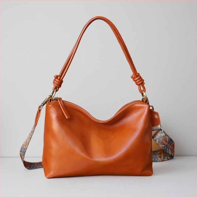 Női kézitáska természetes bőrből, nagy kapacitású, állítható váll- és crossbody pánttal, városi minimalista stílus
